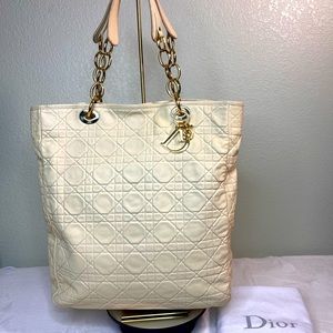 Dior leather tote handbag with gold hardware and charm. Excellent condition!